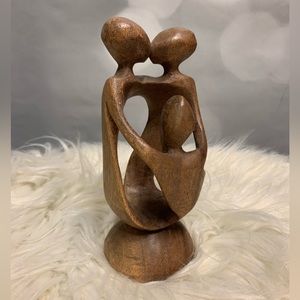 Beautiful wood abstract sculpture. Depicts a couple and‎ one child